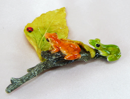 Two Frogs And Beetle On Leaf
